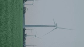 Wind turbines in field with data processing animation over landscape. Renewable, energy, technology, sustainable, windmill, power - Powered by Shutterstock - Get 15% off with code: PIKWIZARD15