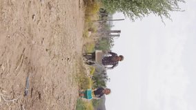 Children walking on dirt path, Vegan Food Locally Grown animation over scene. outdoors, landscape, healthy, organic, outdoors, nature - Powered by Shutterstock - Get 15% off with code: PIKWIZARD15