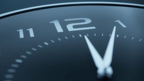 Twelve o'clock on a minimalistic black wall clock. Slow motion, dolly shot, close up. - Powered by Shutterstock - Get 15% off with code: PIKWIZARD15