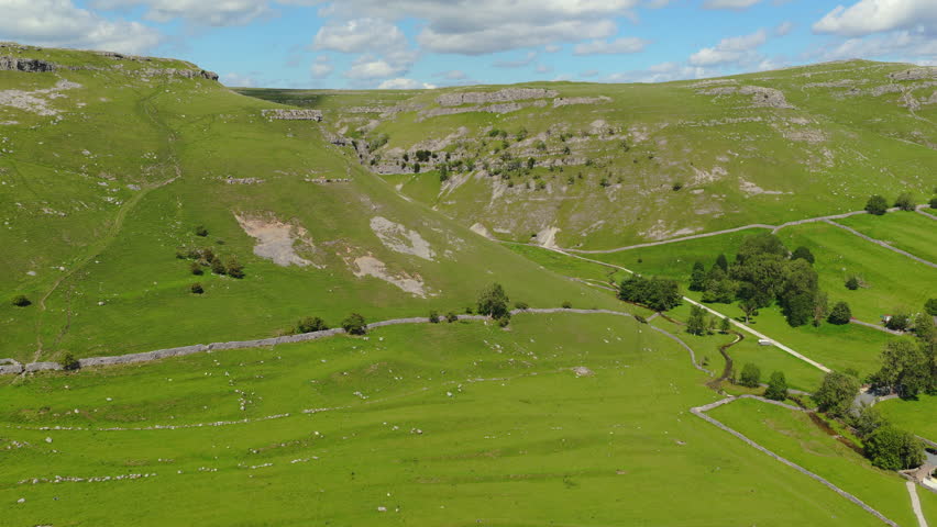 Panoramic Drone Footage of Gordale Scar Valley: Majestic Limestone Cliffs and Verdant Yorkshire Landscape