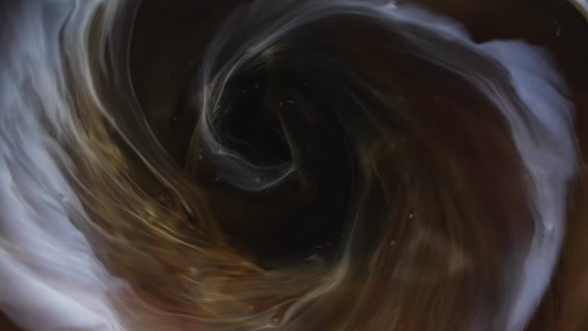 A scene where coffee is mixed with milk