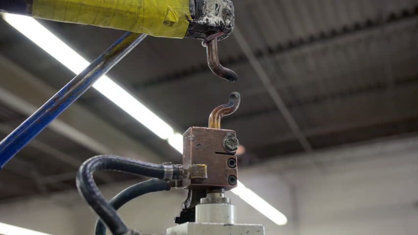 Spot Welder. Element repair auto body shop. The mechanic is doing repairs