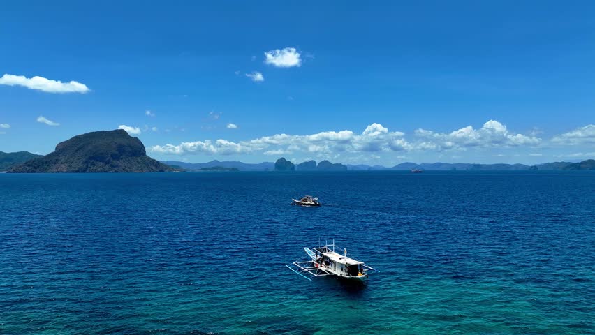 Aerial view of a beautiful tropical island with crystal clear water  with limestone cliffs  as the beach, Coron, Palawan, Philippines.