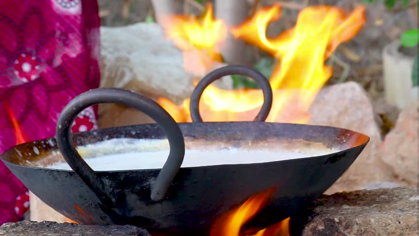 Kheer Making – Traditional Indian Rice Pudding,
Kheer making, the traditional Indian rice pudding dessert, showing the creamy milk base and nuts being added. Perfect for cooking tutorials, recipe blog