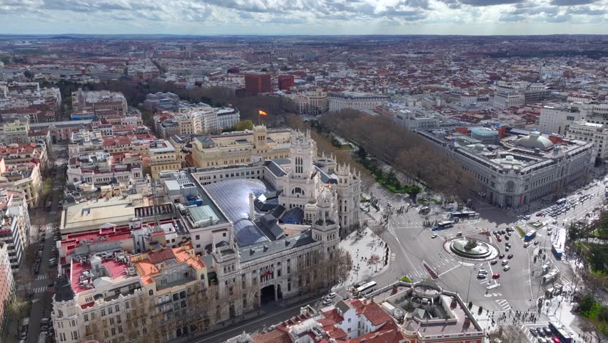 Madrid City Center Gran Via Aerial View of Famous Post Traffic Street Square near Palacio de Cibeles in Madrid, Spain.