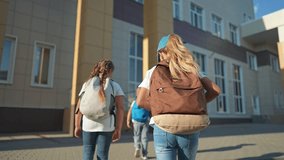 Pupils walking to school with backpacks. Excited children starting new grade. pupils carrying backpacks. Schoolchildren heading class fresh grade. Pupils with backpacks ready for school and new grade. - Powered by Shutterstock - Get 15% off with code: PIKWIZARD15