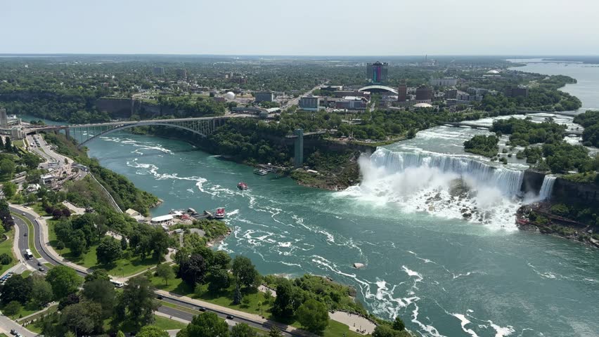 SLOW MOTION The American Falls and Bridal Veil Falls, the U.S. Customs and Border Protection – Rainbow Bridge Port of Entry, and the Prospect Point Observation Tower in Niagara Falls, Ontario, Canada.