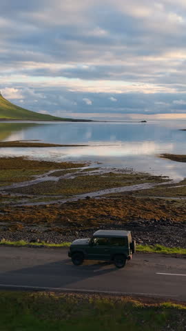Car Through Iceland Landscape mountains Epic Scenic Road Trip Scene. Vertical video
