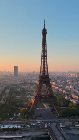 Experience Stunning Aerial Views of the Majestic Eiffel Tower in the Heart of Paris. Vertical video