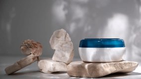 Blank cream container, blue and white, sunlight. Podium, stone, copy space. Beach vacations. Dancing shadow on the wall	
 - Powered by Shutterstock - Get 15% off with code: PIKWIZARD15