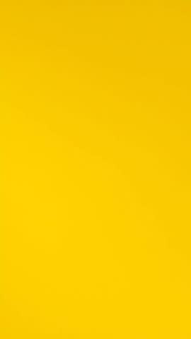 close up the yellow background with a moving blurr force