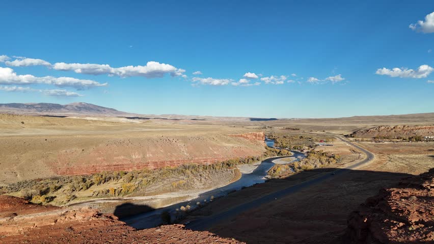 Cinematic drone footage rising above river and road in wind river Wyoming 