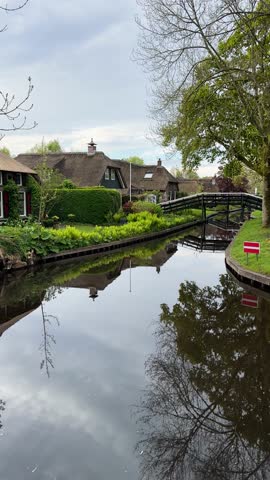 rural dutch traditional country small old town Giethoorn with canals and boats, Netherlands