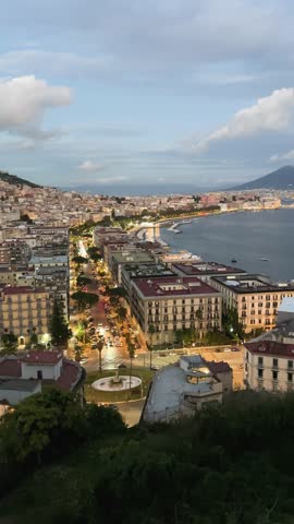 panoramic cityscape Naples with Vesuvius volcano at sunset, Italy