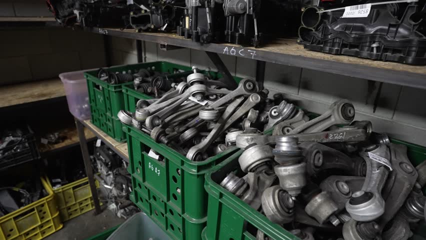 Metal car spare parts in a warehouse. Spare parts warehouse concept.