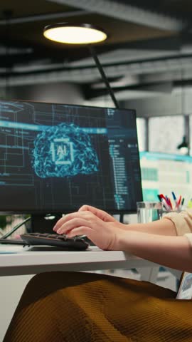 Vertical Video Woman employee using AI machine learning for efficiency recognition, using a synergy of data sharing and optimization models in a co working space. IT company artificial intelligence