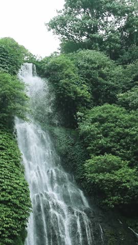 Green Nature of Mountain Landscape and River Waterfall in Summer Forest Park. Outdoors View on Crystal Water Fall at Gorgeous Coast. Wanderlust and Inspiration for Camping Travel and Climbing Tourism