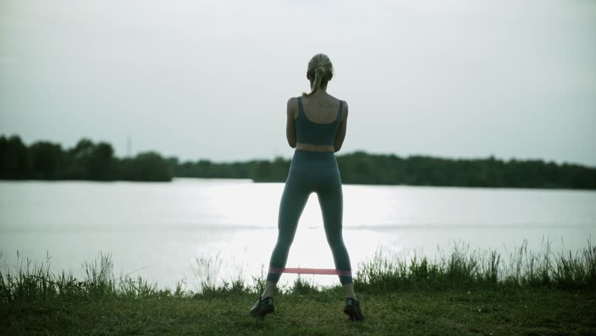 Outdoor Fitness Workout. Strength Development Endurance Building. Healthy Lifestyle Sporty Female Athlete.  Nature Workout Physical Wellness. Glute Strength Training Athletic Performance Wellness
