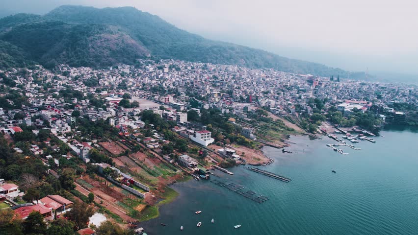 Santiago Atitlan, Guatemala, Drone Shot of Town and Port on Lake Atitlan on Misty Morning