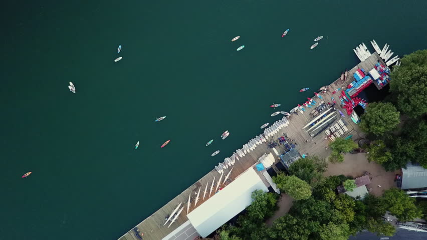 Overhead of Kayakers and Stand Up Paddleboarders by Lake Dock