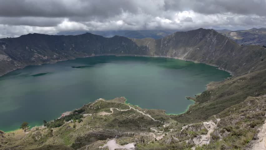 Sweeping Aerial View of Quilotoa Crater Lake and Cloudy Sky – Ecuador Volcanic Landscape