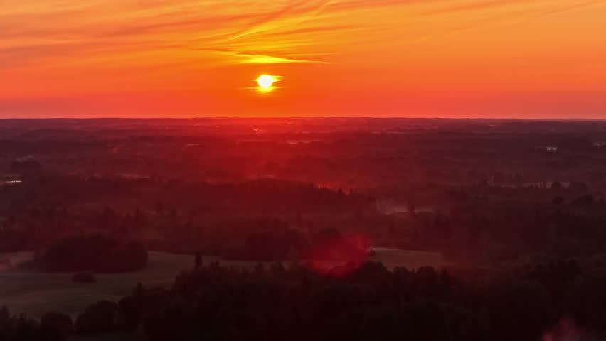 Sunset - Sun In The Orange Skies At Dusk Over The Trees. - aerial shot