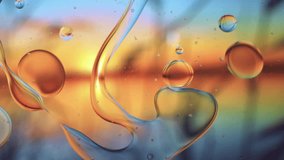 Abstract Colorful Organic Food Oil Drops Bubbles On Water Surface. Horizontal and vertical video. Double - Powered by Shutterstock - Get 15% off with code: PIKWIZARD15