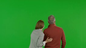 Happy Couple Embraced Medium Back view On Green Screen. Happy couple with modern look embraced in romantic scene on transparent background. Senior old man woman elderly retired. chroma key isolated - Powered by Shutterstock - Get 15% off with code: PIKWIZARD15