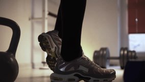 Close-up of a pair of men legs in preparation for a workout at the gym - Powered by Shutterstock - Get 15% off with code: PIKWIZARD15