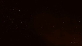 Flying glowing fire sparks in darkness, isolated particles of burning embers on black background, 4K slow motion with selective focus - Powered by Shutterstock - Get 15% off with code: PIKWIZARD15