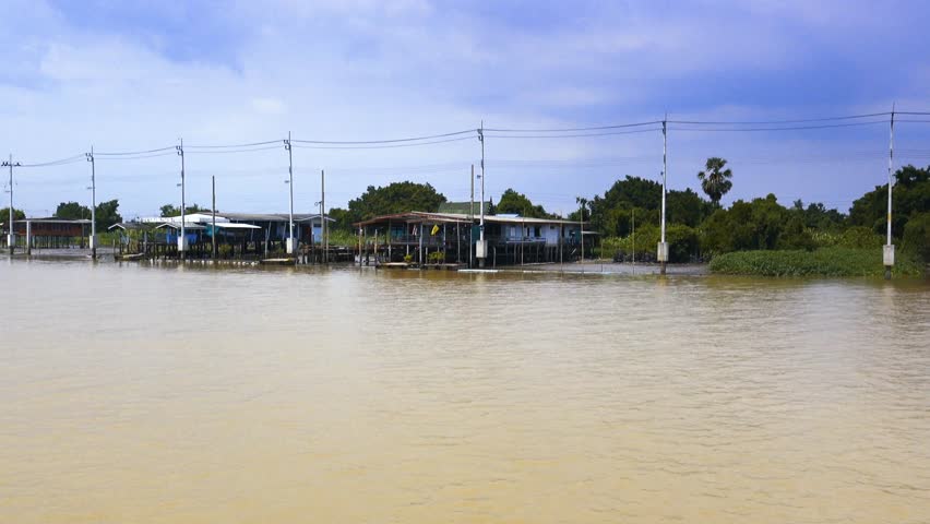 The riverside houses are the residences of the Thai community living along the Chao Phraya River in Thailand.