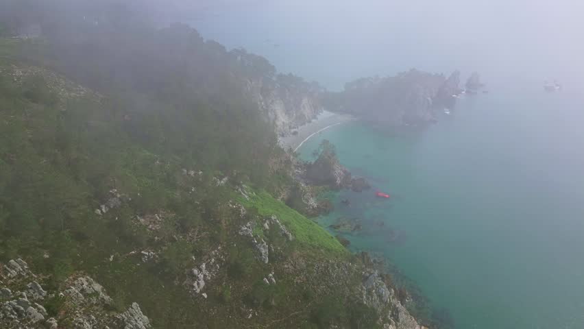 Panorama drone view of the foggy and misty Virgin Island Beach aka Plage de l'ile Vierge, Crozon peninsula, Brittany, France.