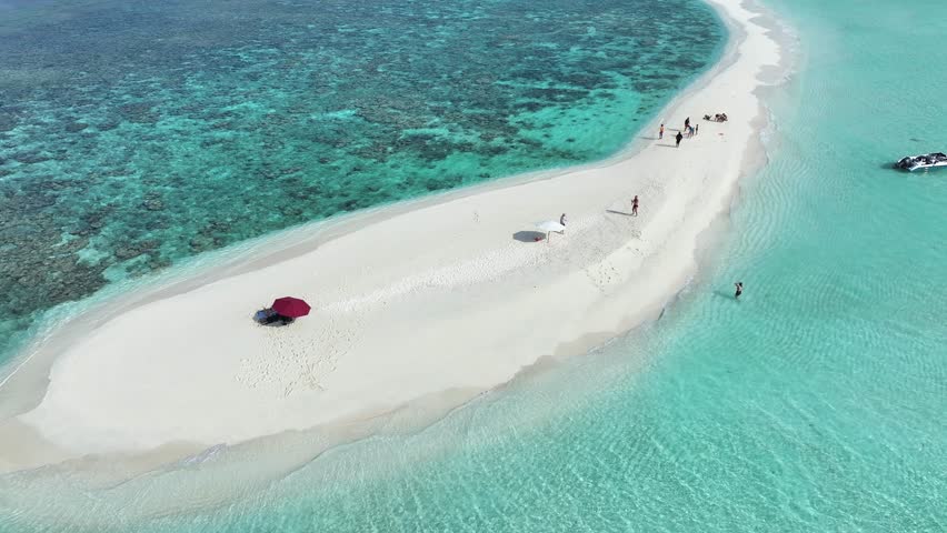 Aerial view of the pristine white sandbank meets the turquoise sea, a scene of serene beauty and tranquility, Thoddoo, Alif Alif Atoll, Maldives.