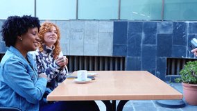 Two friends sitting at an outdoor cafe smile as one taps a credit card on a wireless POS device held by the waiter, demonstrating contactless payment, cashless convenience and urban leisures.  - Powered by Shutterstock - Get 15% off with code: PIKWIZARD15