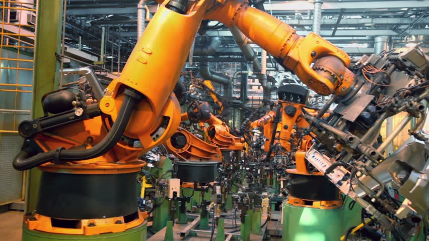 Robots weld car parts in production line at factory Royalty-Free Stock Footage #3851411