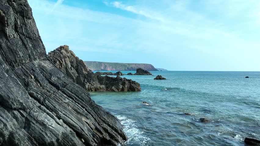Aerial Drone View of Rugged Welsh Coastline with Cliffs and Sandy Beach