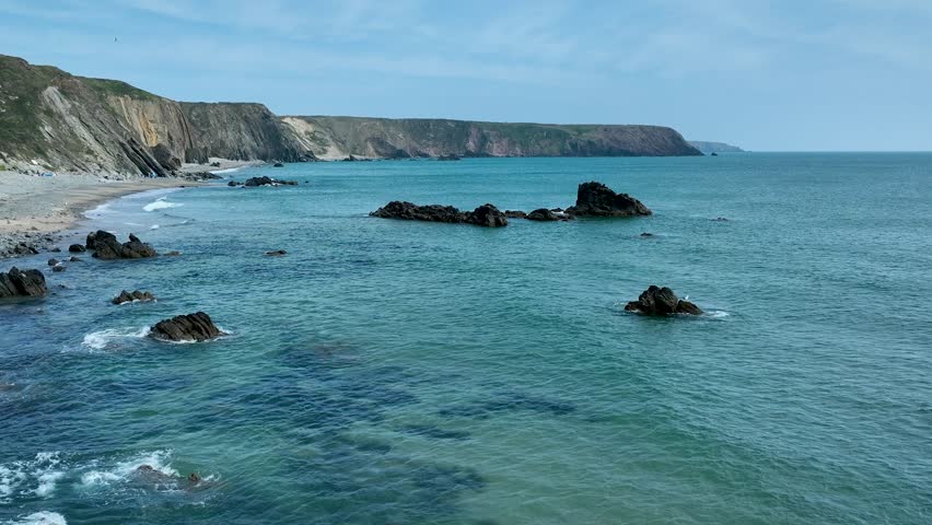Aerial Drone View of Rugged Welsh Coastline with Cliffs and Sandy Beach