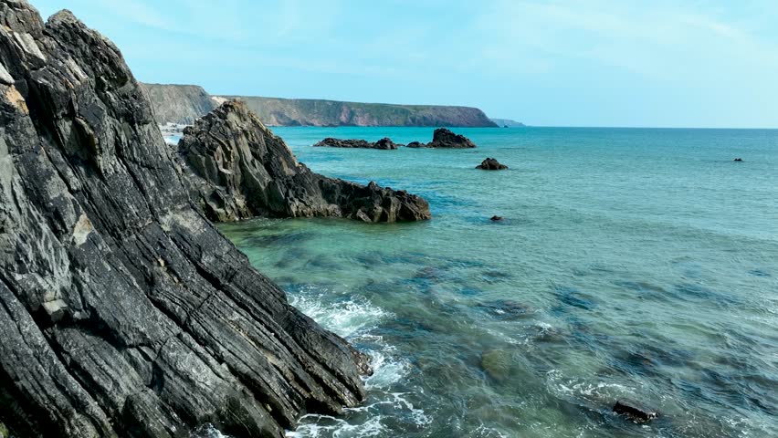 Aerial Drone View of Rugged Welsh Coastline with Cliffs and Sandy Beach