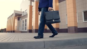 Businessman walking on sidewalk, people walking. Office pedestrian walking on city street to work. City life of people. Man with briefcase in business suit walking on street from work. Business, city - Powered by Shutterstock - Get 15% off with code: PIKWIZARD15
