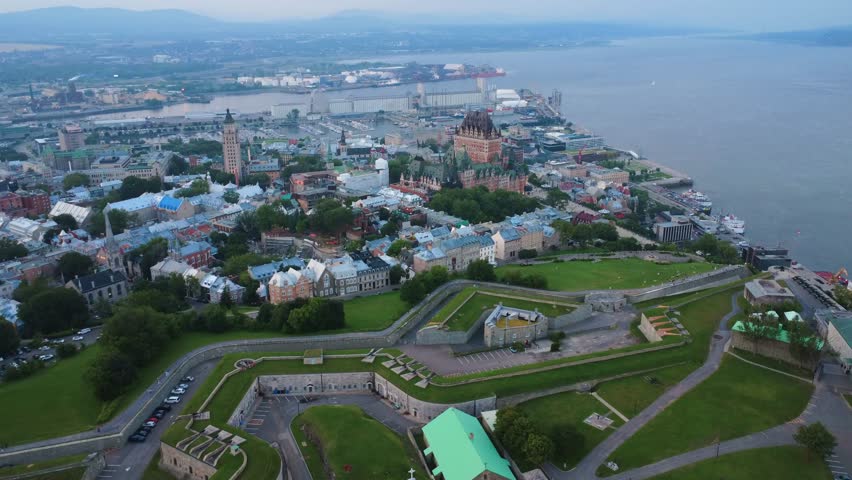 Panoramic aerial view of the tourist area of Old Quebec with its chateau hotel and port in the background on the banks of the Saint Lawrence River, Quebec City, Canada, July 2025.