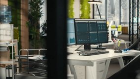 Empty business offices with dual monitors running financial diagnostics to help planning development strategy, data analytics and performance metrics. efficiency at the workspace. - Powered by Shutterstock - Get 15% off with code: PIKWIZARD15