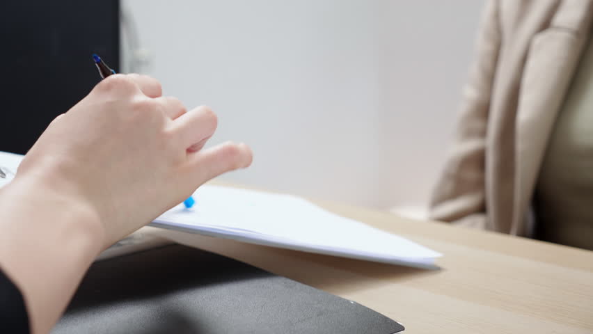 Close up recruiter presenting contract agreement, candidate signing job with success hiring, human resources, candidate signing employment contract with HR manager, job interview, business concept.