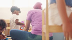 Happy diverse children boy and girl friends playing developmental toys in classroom. School student enjoy and fun learning, studying and playing for development knowledge education at primary school. - Powered by Shutterstock - Get 15% off with code: PIKWIZARD15