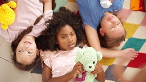 Portrait of Happy diverse children girl friends playing doll together in classroom. School student enjoy and fun learning, studying and playing for development knowledge education at primary school. - Powered by Shutterstock - Get 15% off with code: PIKWIZARD15