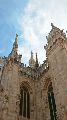 Zoom shot of the details on Duomo Cathedral in Milan, Italy. Vertical