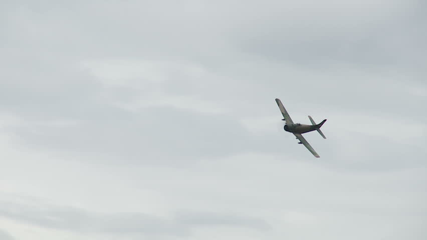 Douglas Skyraider historic plane flies past.  Recorded in slow motion at 60fps.