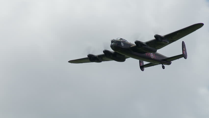 Avro Lancaster bomber plane from World War II flying at normal speed until it