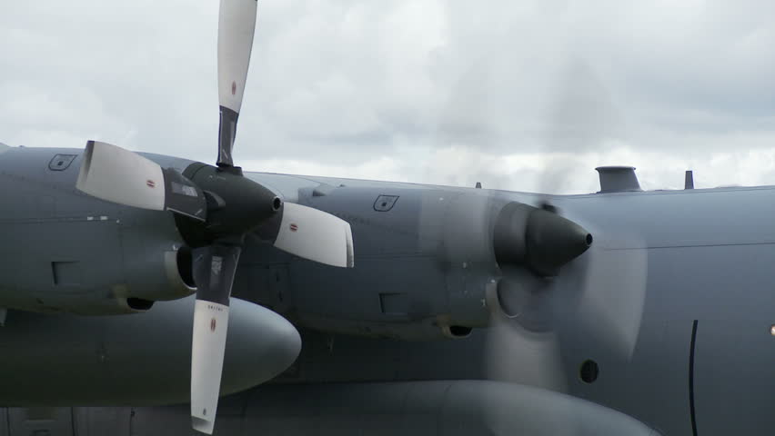 Lockheed Hercules military transport aircraft starts its propellers.