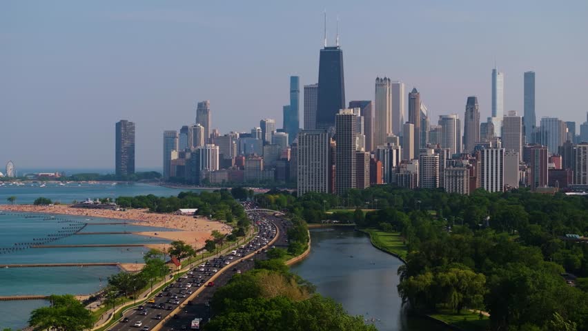 Drone Ascends to Reveal Chicago Skyline. North Avenue Beach and Lake Michigan