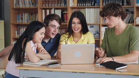 Group of college students working together on a high school project using laptop in the campus library - Powered by Shutterstock - Get 15% off with code: PIKWIZARD15